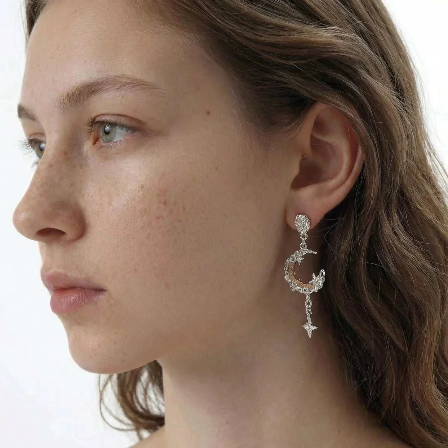 Celestial moon star earrings with textured silver crescent, golden mesh center, and sparkling star detail by Najera Studio