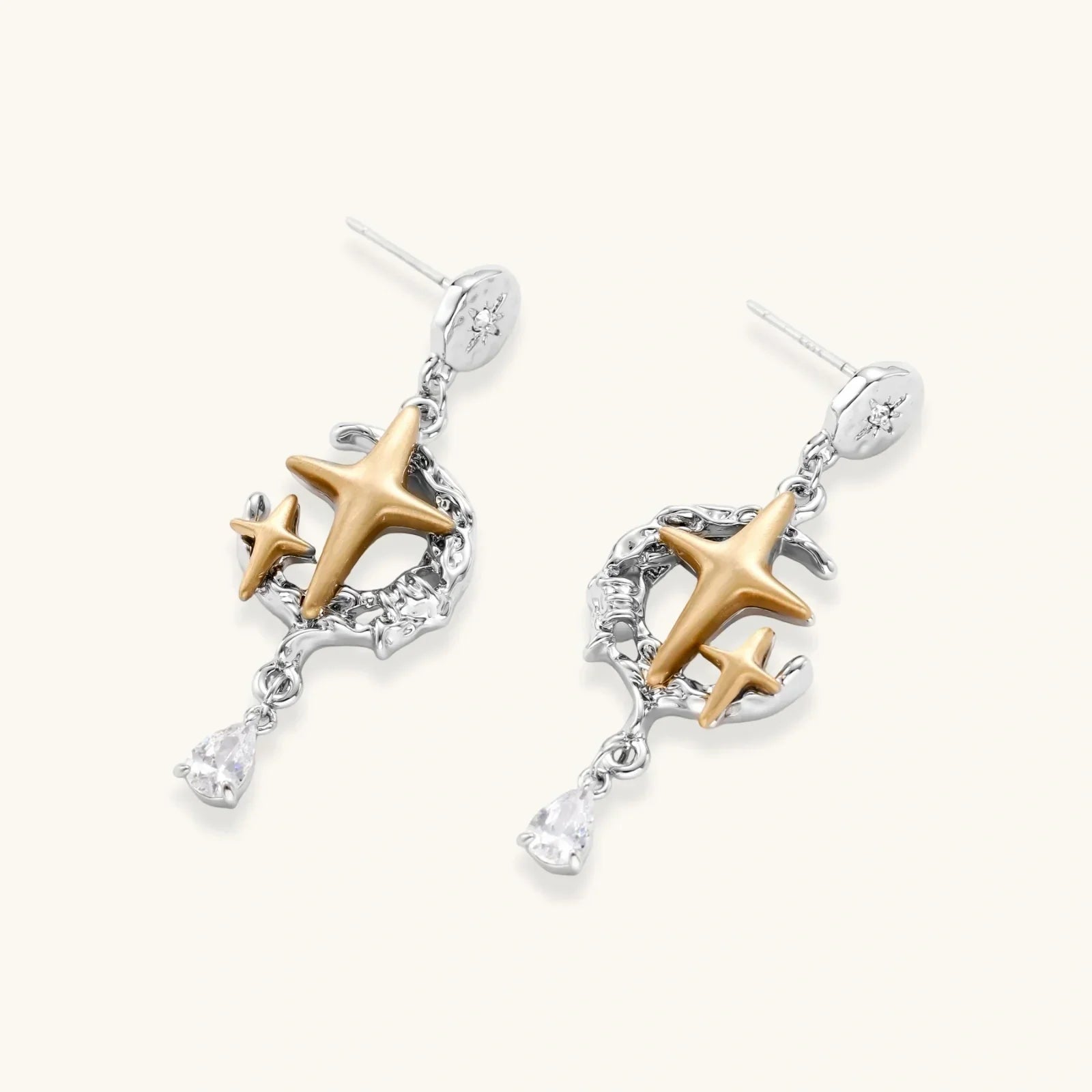 Celestial Star Drops earrings with mixed-metal design featuring hammered silver discs, gold star, silver vines, and pear-cut zirconia by Najera Studio