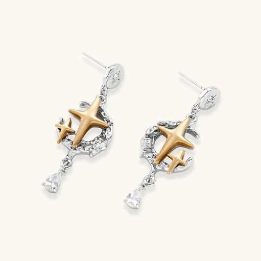 Celestial Star Drops earrings with mixed-metal design featuring hammered silver discs, gold star, silver vines, and pear-cut zirconia by Najera Studio